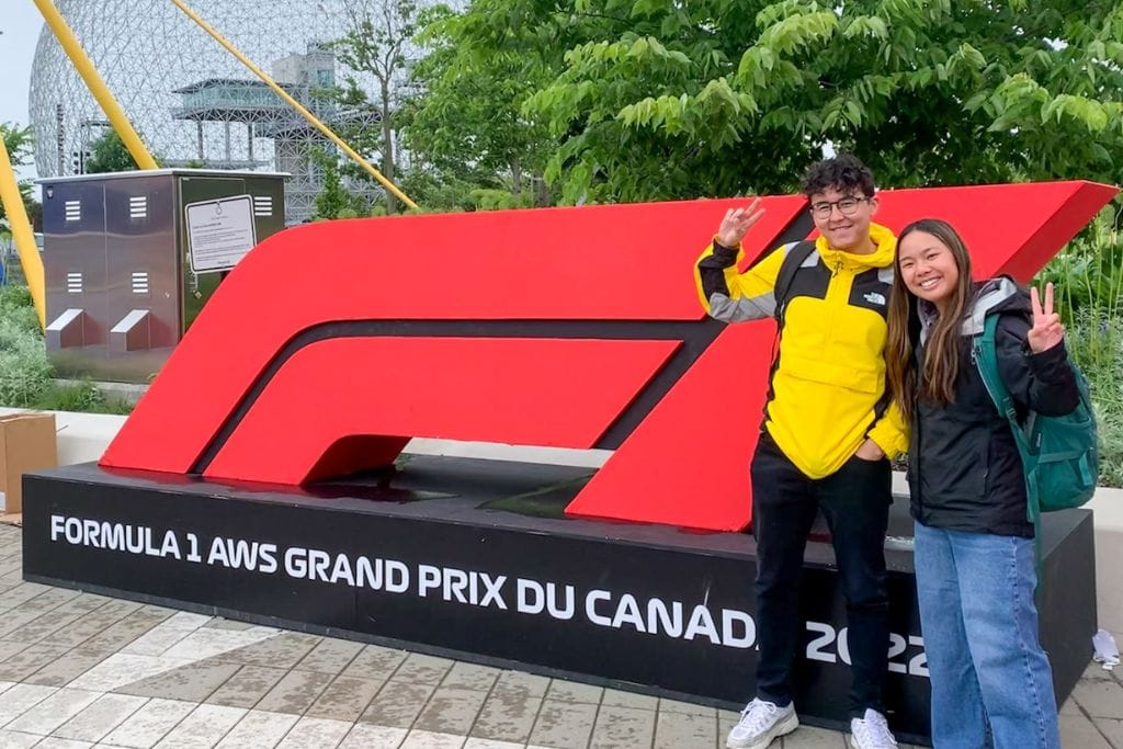 A picture of Kristin and a friend in front of the massive F1 Canadian Grand Prix sign in Parc Jean Drapeau.