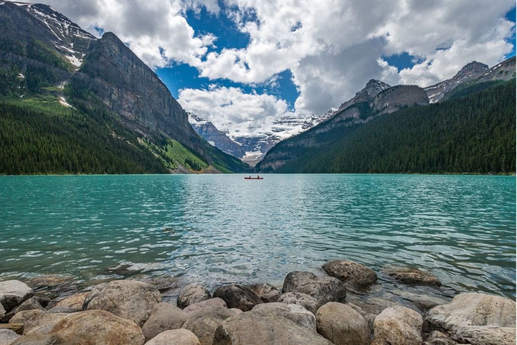 A picture of the famous Lake Louise with hardly anyone on the lake. This is the fifth stop on our 4-Day Banff Itinerary.