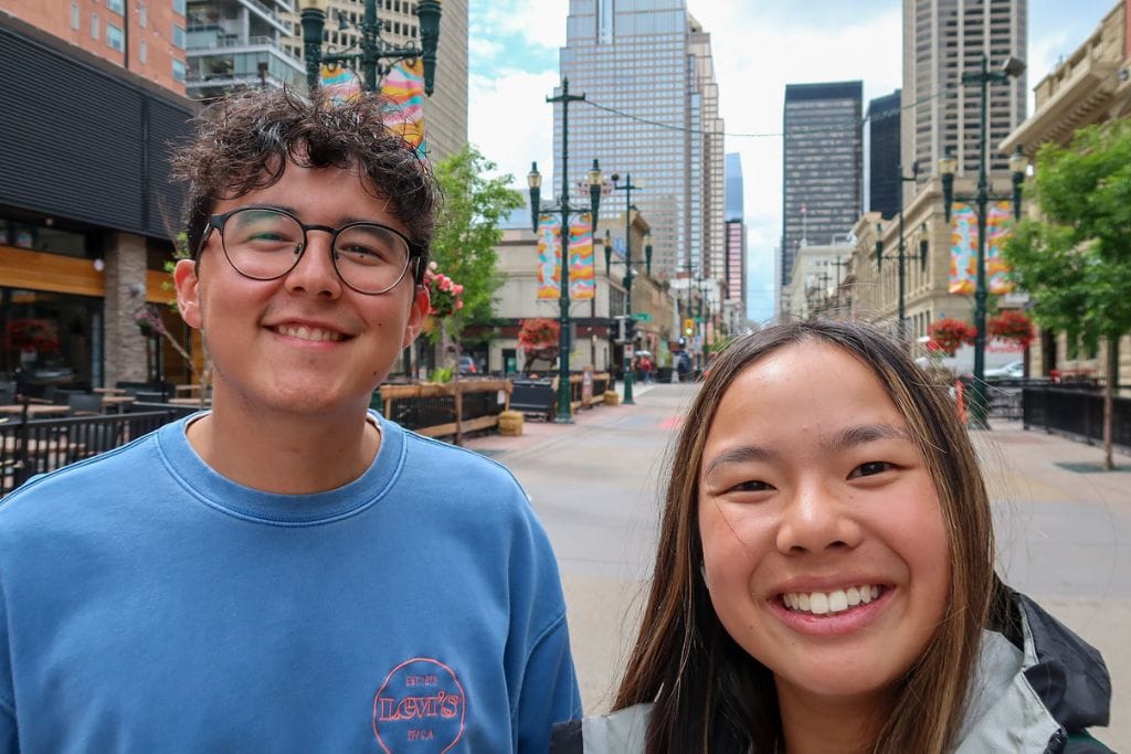 A picture of Kristin and her friend as they walk down Stephen Avenue Walk.