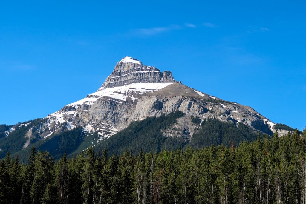 A picture of one of the snow-capped mountains in Banff National Park. During your 4-Day Banff Itinerary, you'll be able to appreciate the striking mountaintops!