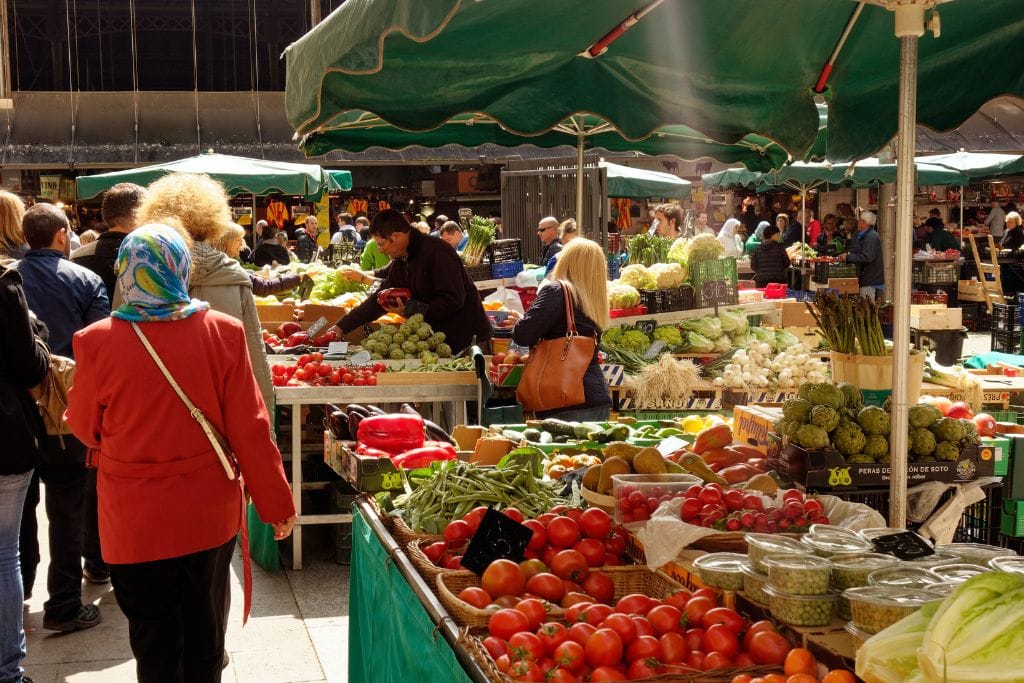 A picture of one of the many outdoor farmers markets that you can find in the streets of Paris. Shopping local is a great way to keep prices down and Paris worth the visit!