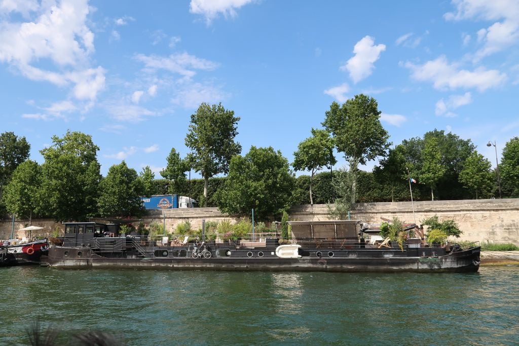A picture of some boats parked in the Seine. Cruising down the famous Seine is another reason why Paris is worth visiting because it gives you a fresh perspective of Paris. 