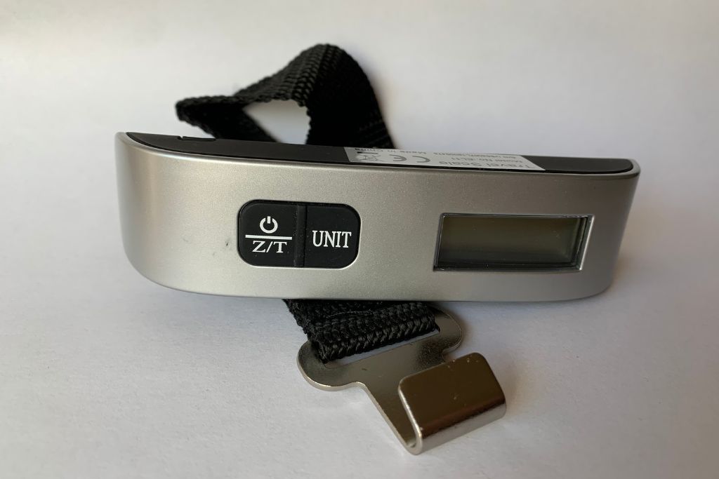 A picture of the portable luggage scale I use. Carrying a portable luggage scale with you is a great tip for first time flyers to avoid having to pay overweight luggage fees.