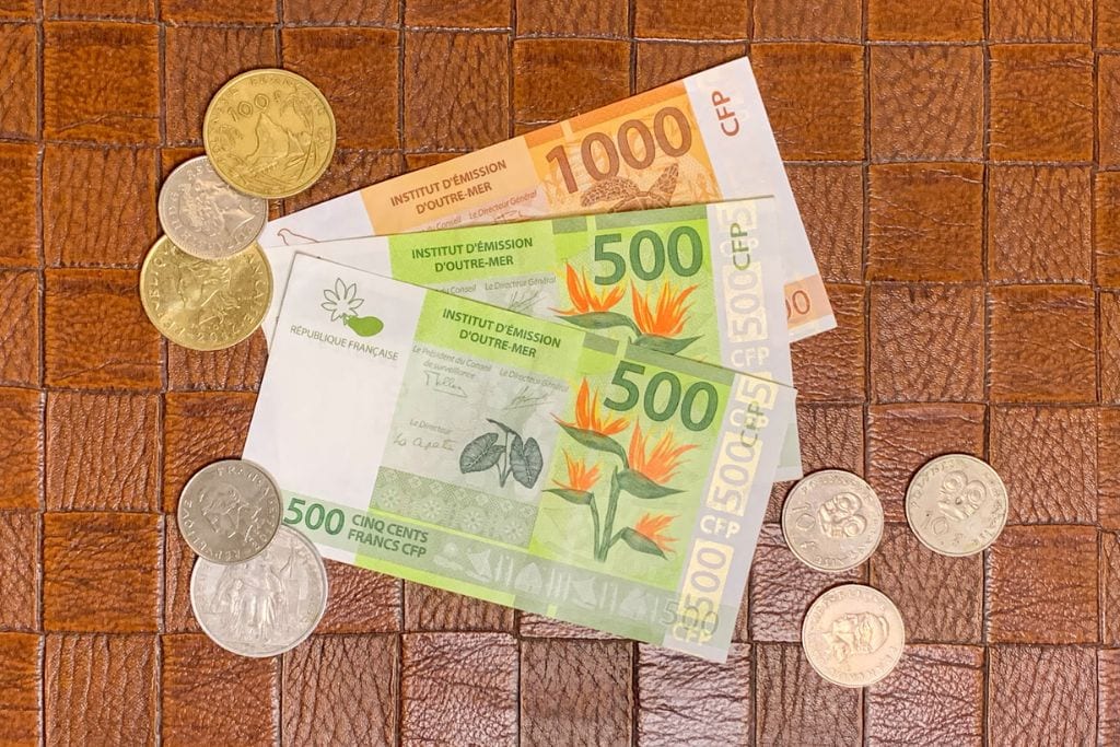 A picture of French Polynesian cash and coins.