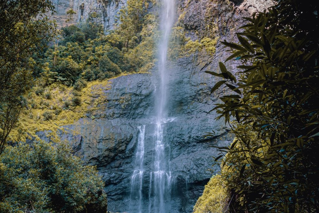 A picture of Fautaua waterfall as you approach it from the base of the waterfall. Hiking in Tahiti is a must-do!