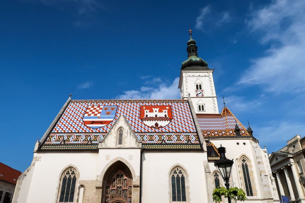 A picture of St. Marks Church and its iconic glazed tile roof.