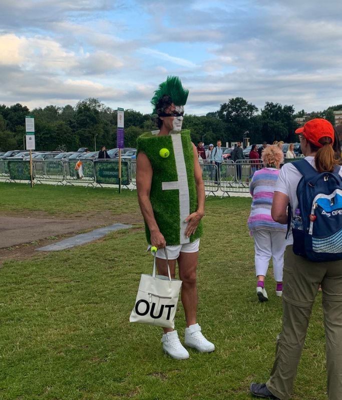 A picture of a tennis fan dressed like a tennis court!