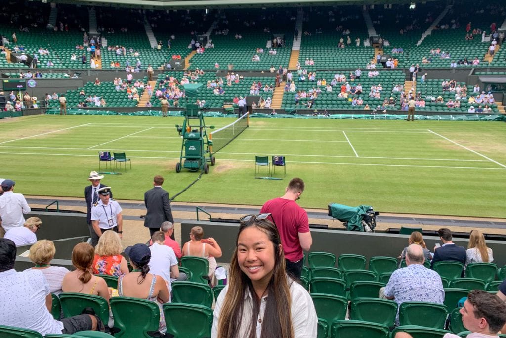 A picture of Kristin sitting on Centre Court in the 8th row after 50+ hours of queueing for Wimbledon!