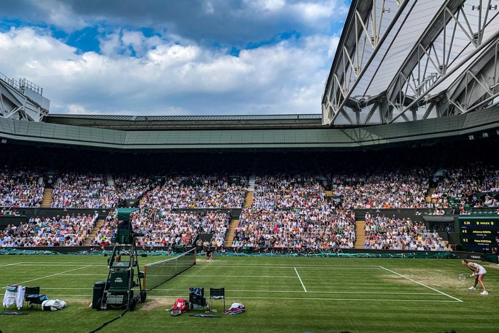 A picture of Petra Kvitova playing against Johanna Konta on Centre Court at Wimbledon.