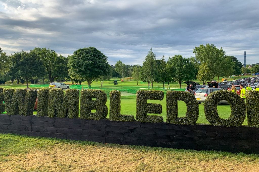 A picture of a grass structure that spells Wimbledon that queuers saw as they waited in line.