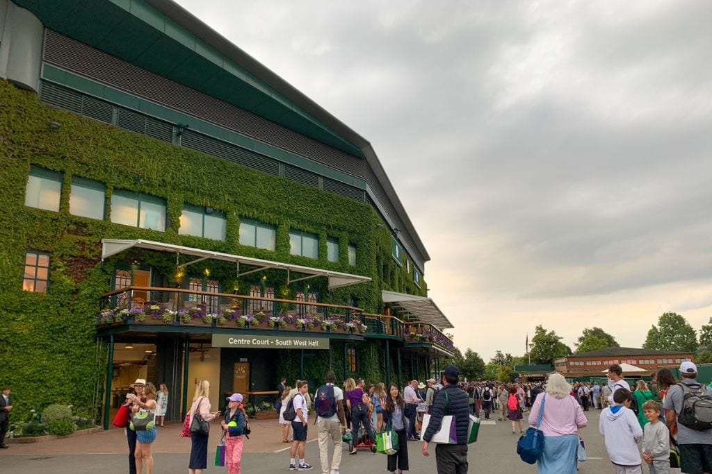A picture of the Wimbledon grounds with the Centre Court Stadium in the background.