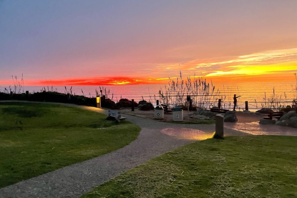 A picture of the little park that you pass as you walk to Del Mar Beach. The picture also features an epic colorful sunset!
