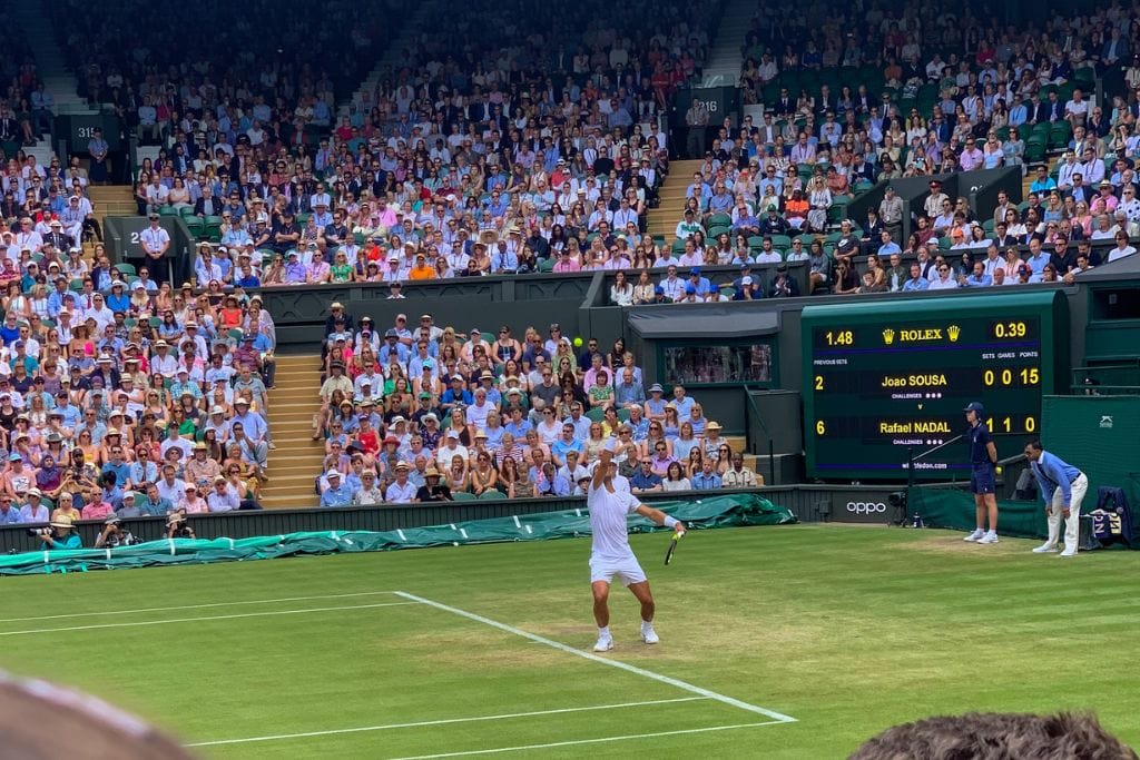 A picture of Rafa serving on Centre Court at Wimbledon.