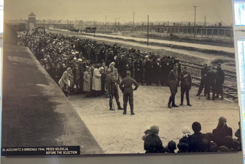 Picture of a picture taken inside Auschwitz I camp. These are the lines that were formed when Jews were initially brought to Auschwitz. Their fate was decided by a single man waving his finger in a direction. 