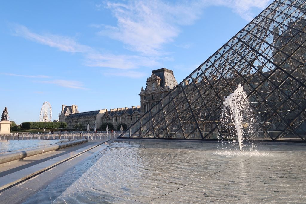 A picture of the courtyard and famous Pyramid entrance to the Louvre. Even if you don't go inside the Louvre in Paris, its worth visiting the area to see the marvelous architecture.