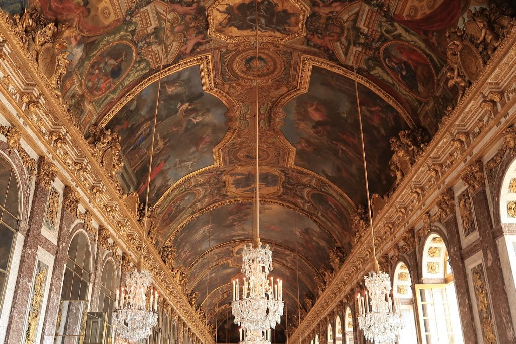 A picture of the hall of mirrors in the Palace of Versailles.