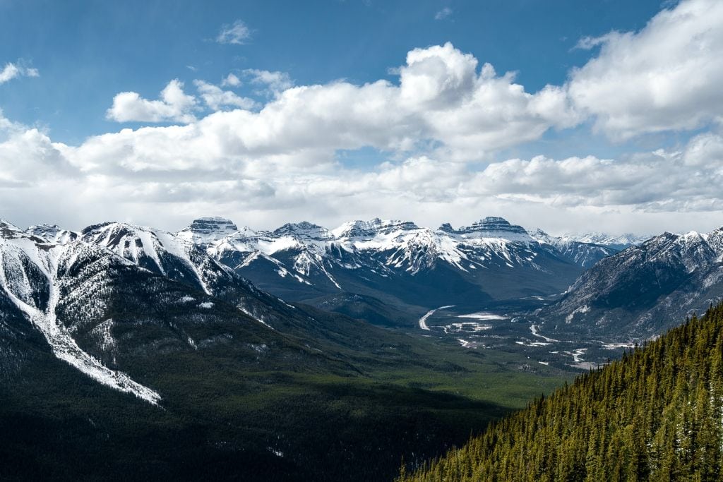 A picture of Bow Valley as seen from the top of Sulphur Mountain. Ascending to the top of the mountain is one of the best things to do in Banff and an absolute must for any 4-Day Banff Itinerary!