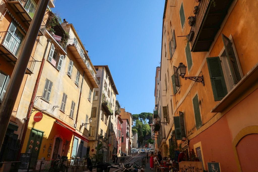 A picture of the orange and colorful buildings that can be found in Nice's Old Town.