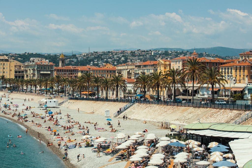A picture of the idyllic Nice coastline. Soaking up the sun is a great way to relax during your one day in Nice France.