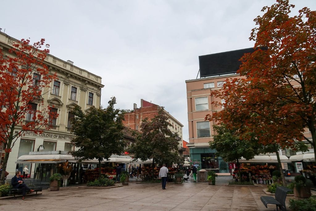 A picture of one of the squares in Zagreb. The clouds are dark and you can tell it's been raining.
