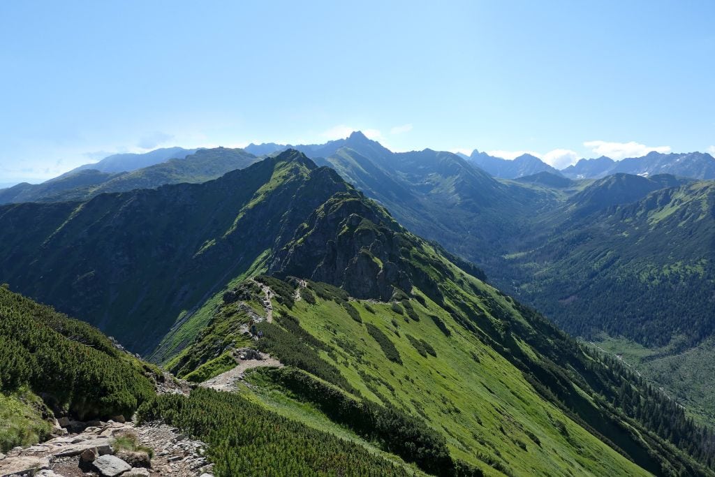 A picture of a trail through the Tatra Mountains on a sunny day.