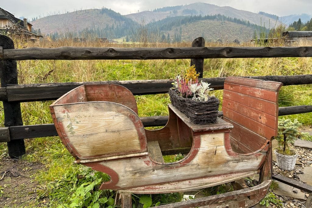 A picture of a wooden sleigh that can be seen at the shephard's hut during the Zakopane tour from Krakow.