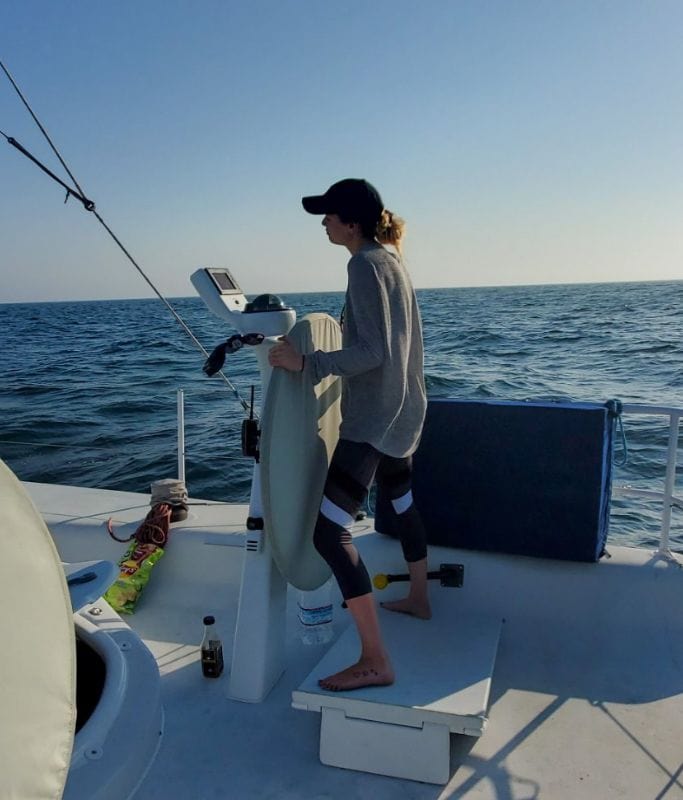 A picture of my friend steering the boat in San Diego.