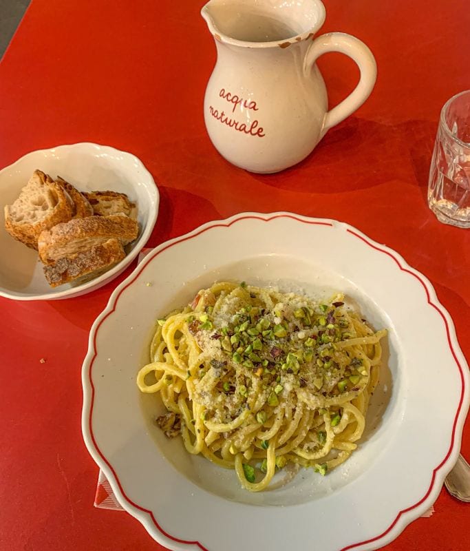 A picture of pasta and bread from the restaurant Mi Scusi in Milan. The food in Paris tends to be cheaper than the food in Milan.