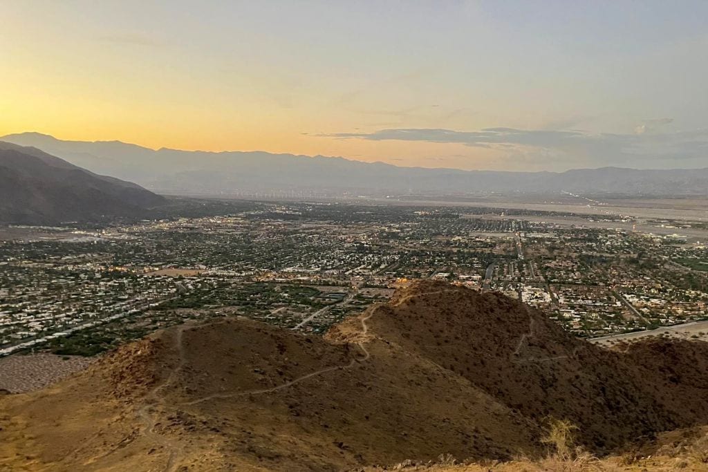 A picture of the greater Palm Springs area taken from a higher vantage point on the mountains. You can tell it's sunset.