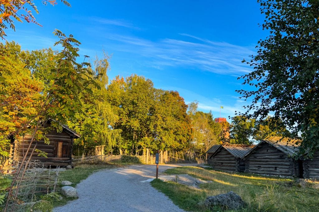 A picture of several wooden buildings that make up the summer pasture farm. For those interested in taking in 500+ years of history, Skansen is worth visiting