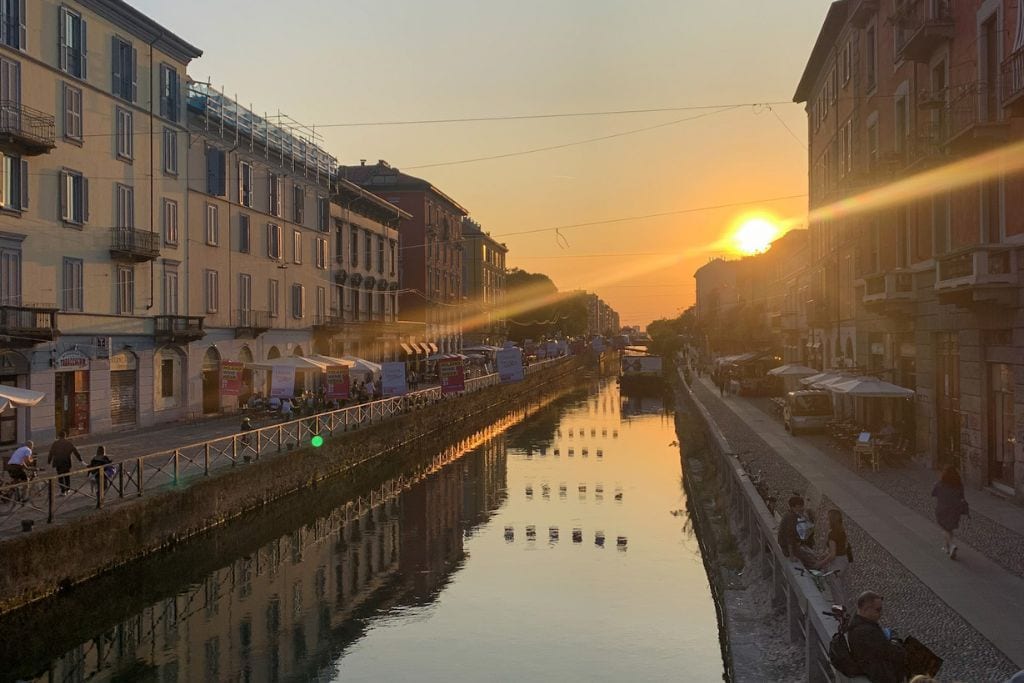 A picture of the Navigli canals in Milan as seen around sunset. Paris has more geographical features than Milan, but Milan does have canals in the city!