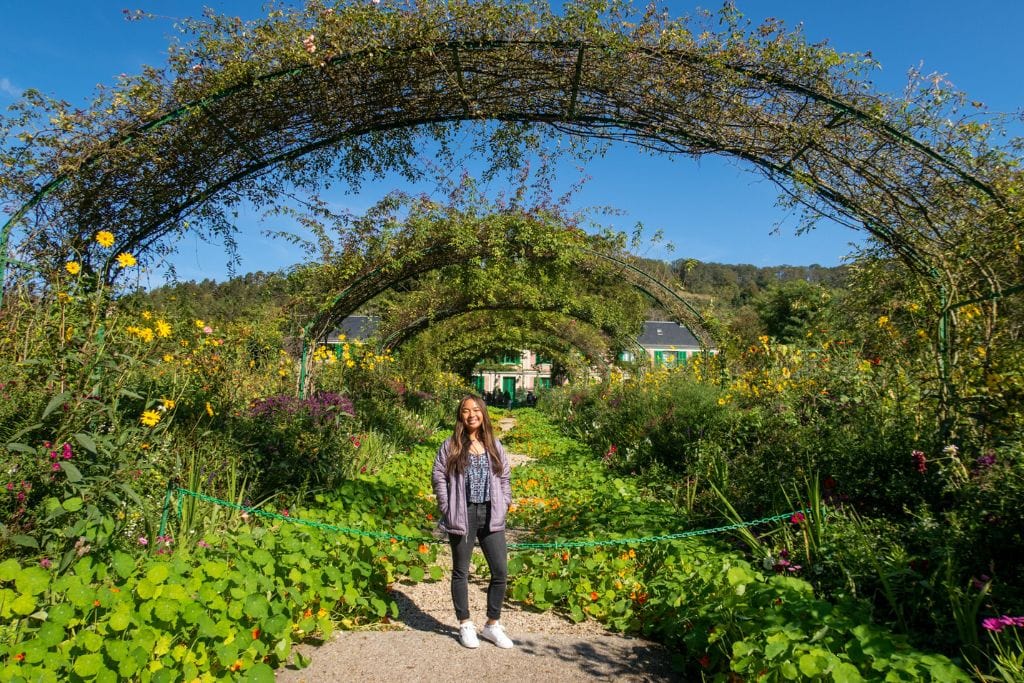 A picture of Kristin in Claude Monet's Gardens in Giverny. Paris is better than Milan for day trips since you can easy day trip to 30+ different famous cities and locations.