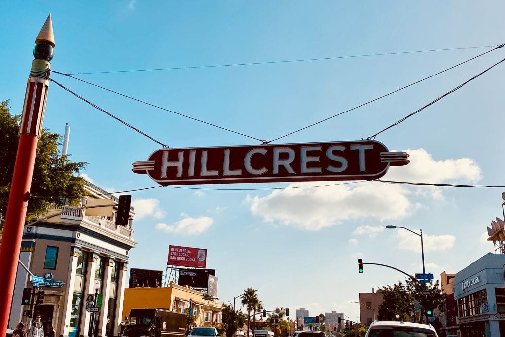 A picture of the sign that reads Hillcrest. Hillcrest is one of the most walkable neighborhoods in San Diego.