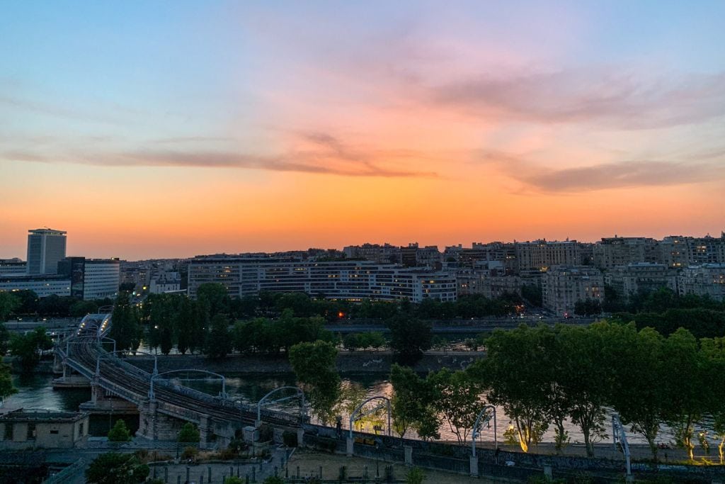 A picture of the sunset over the Parisian cityscape from my apartment when I lived in Paris.