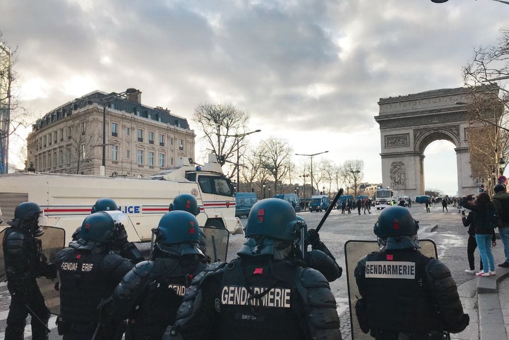 A picture of officers near the Arc de Triomphe. Sometimes people develop Paris Syndrome because they realize that Paris is not nearly as safe as they believed it to originally be.