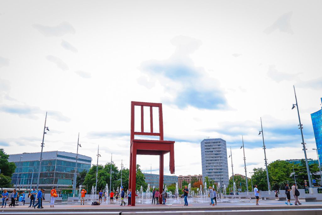 A picture of a massive red chair that is broken. It is near the United Nations building and symbolizes the fragility and stability of our nations. 