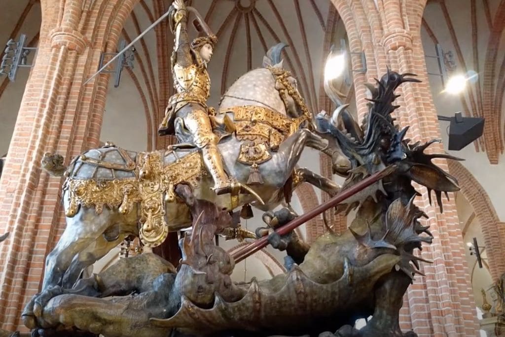 A picture of the medieval sculpture of Saint George and the Dragon in the Stockholm Cathedral.