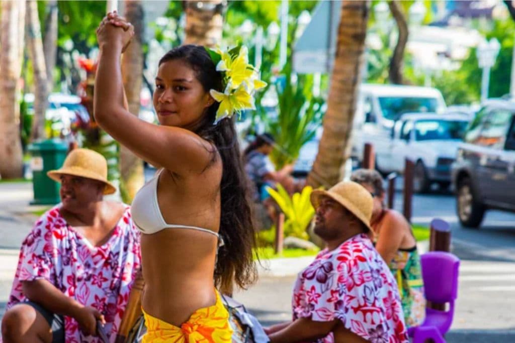 A picture of a local French Polynesia girl dancing. You can learn about French Polynesia's rich culture on the Tahiti walking tours.
