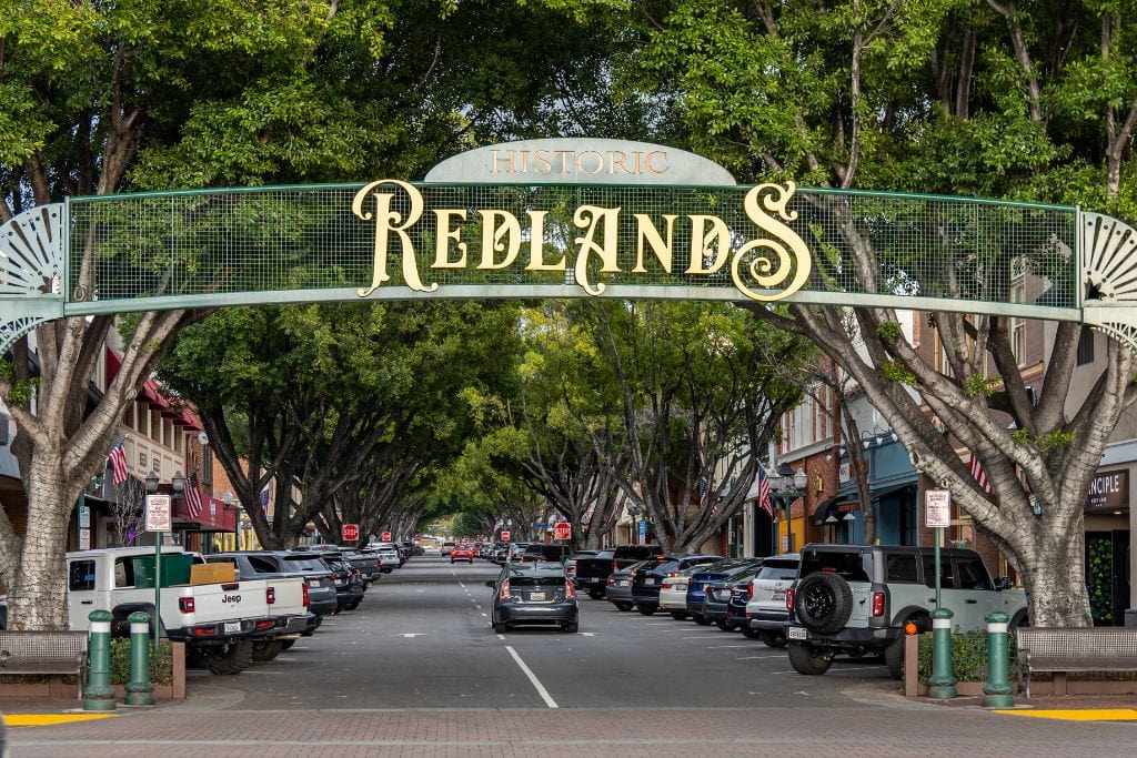 A picture of the sign of Redlands in downtown Redlands.