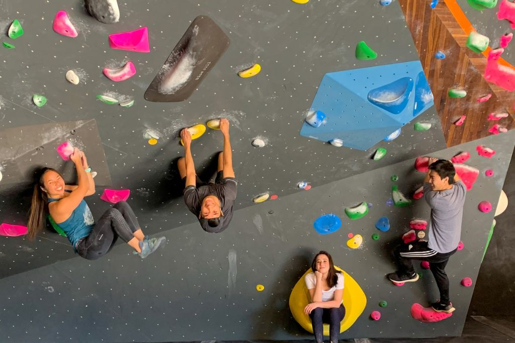 A picture of Kristin and her friends rock climbing. If you are looking to avoid the heat or get some exercise in but in a fun way, rock climbing is another great activity to do in Redlands.