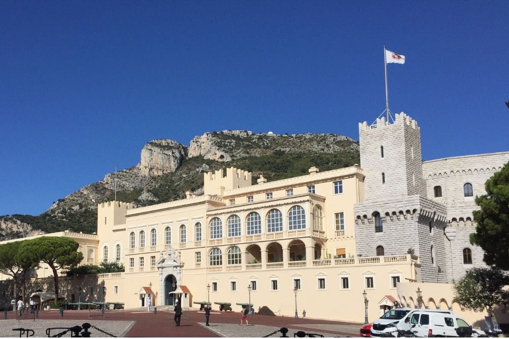 A picture of the Prince's Palace in Monaco. Even though it's not that impressive from the outside, the views next to it are incredible and worth visiting on your Nice to Monaco Day Trip