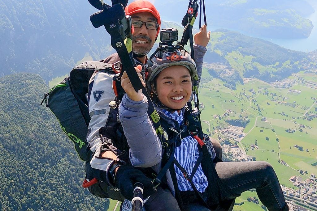 A picture of Kristin and her pilot paragliding!