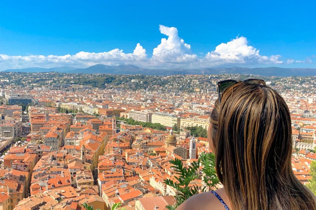A picture of Kristin looking at all the red roof tops in Nice. Nice has lots of smaller buildings that are spread out across the city where as Monaco has lots of skyscrapers since there's less space.