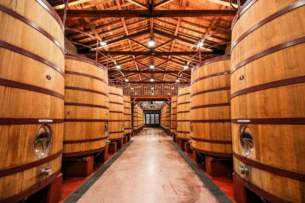 A picture of barrels of wine in a winery in Rioja. If you want to get an insider's look at the local wineries, I recommend doing a Rioja Wine Tours From Bilbao