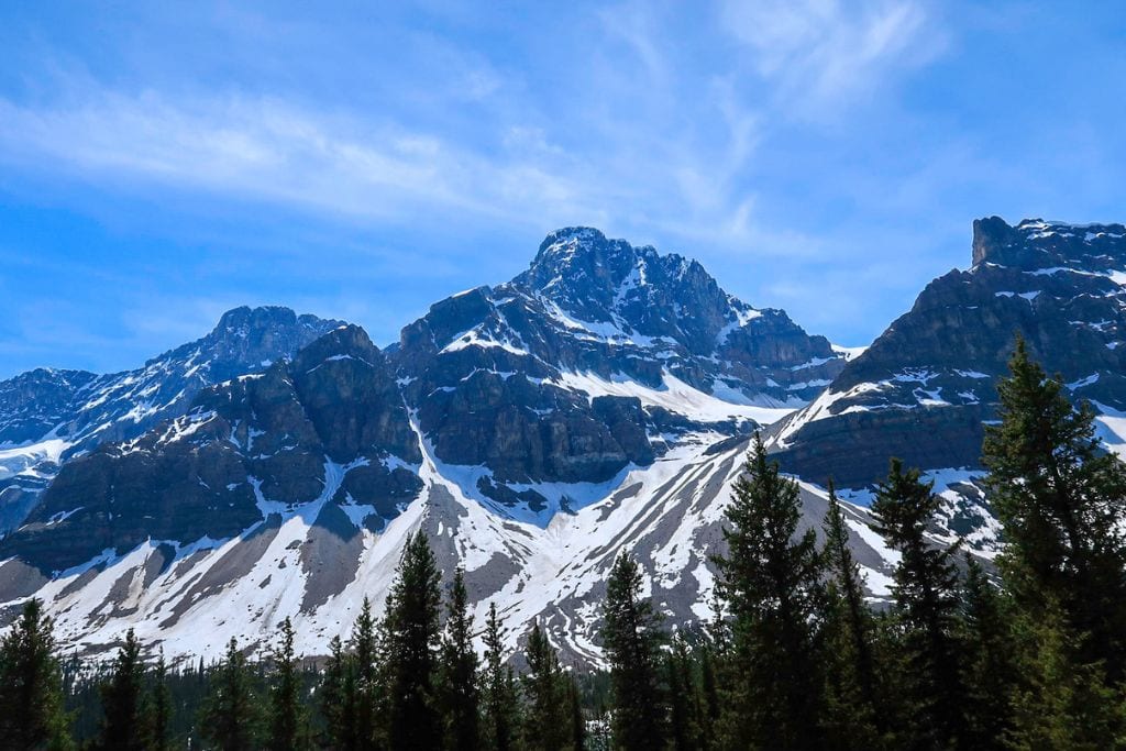 A picture of the snow-capped mountains. This Calgary to Banff tour drives you along this scenic road!