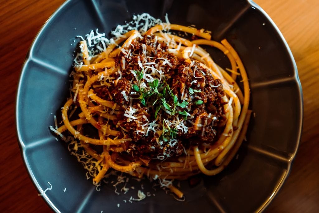 A picture of a plate of Bolognese pasta. Indulge in yummy Italian food during a San Diego food tour in Little Italy.