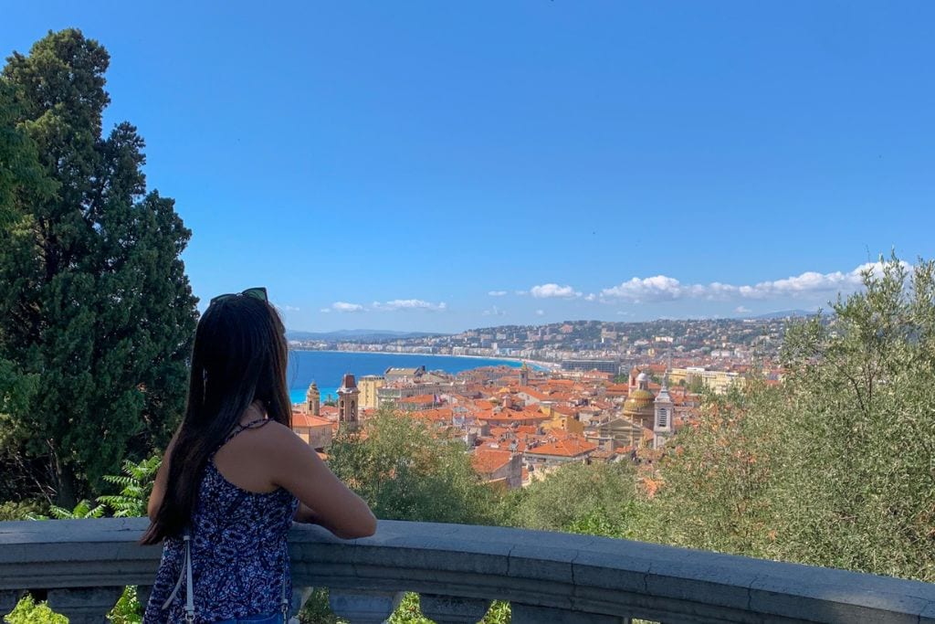 A picture of Kristin looking at the view of one of the panoramic points in Nice.