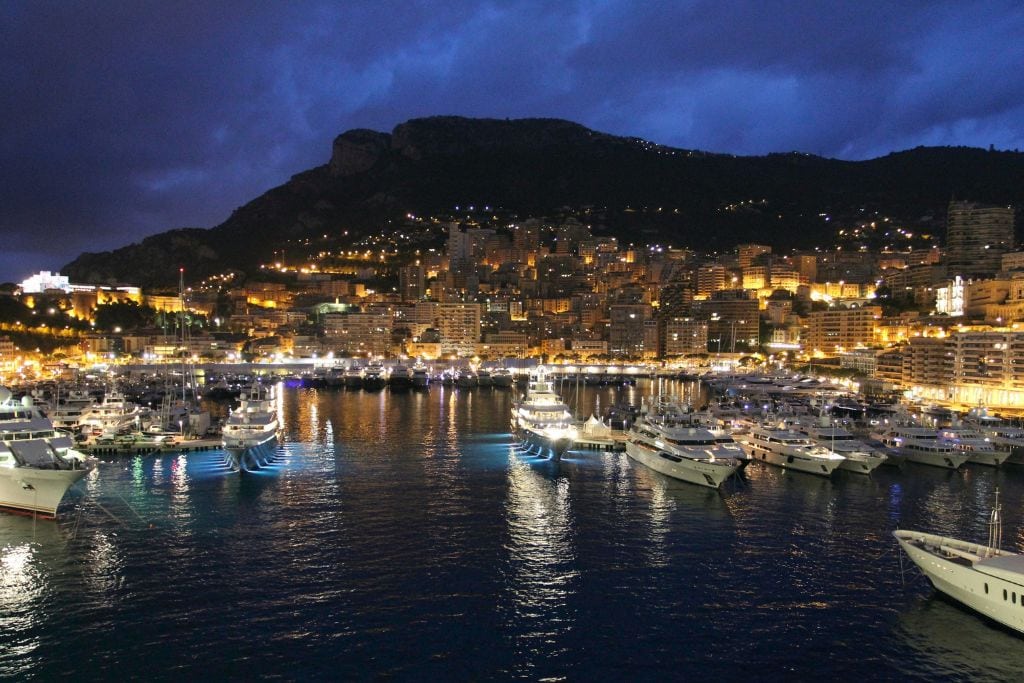 A picture of the Monaco Hercules Harbour at night. While there aren't any Monaco Boat Tours that operate at night, you can take on at sunset!