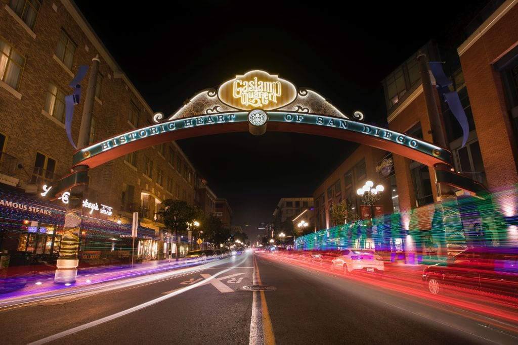 A picture of the Gaslamp Quarter sign lit up at night. This is the meeting spot for the Brothels, Bites, and Booze food tour in San Diego.