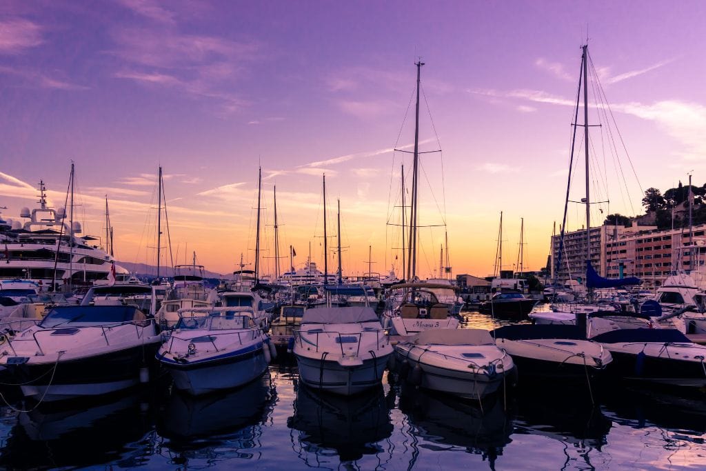 A picture of the boats in Monaco's harbor at sunset.